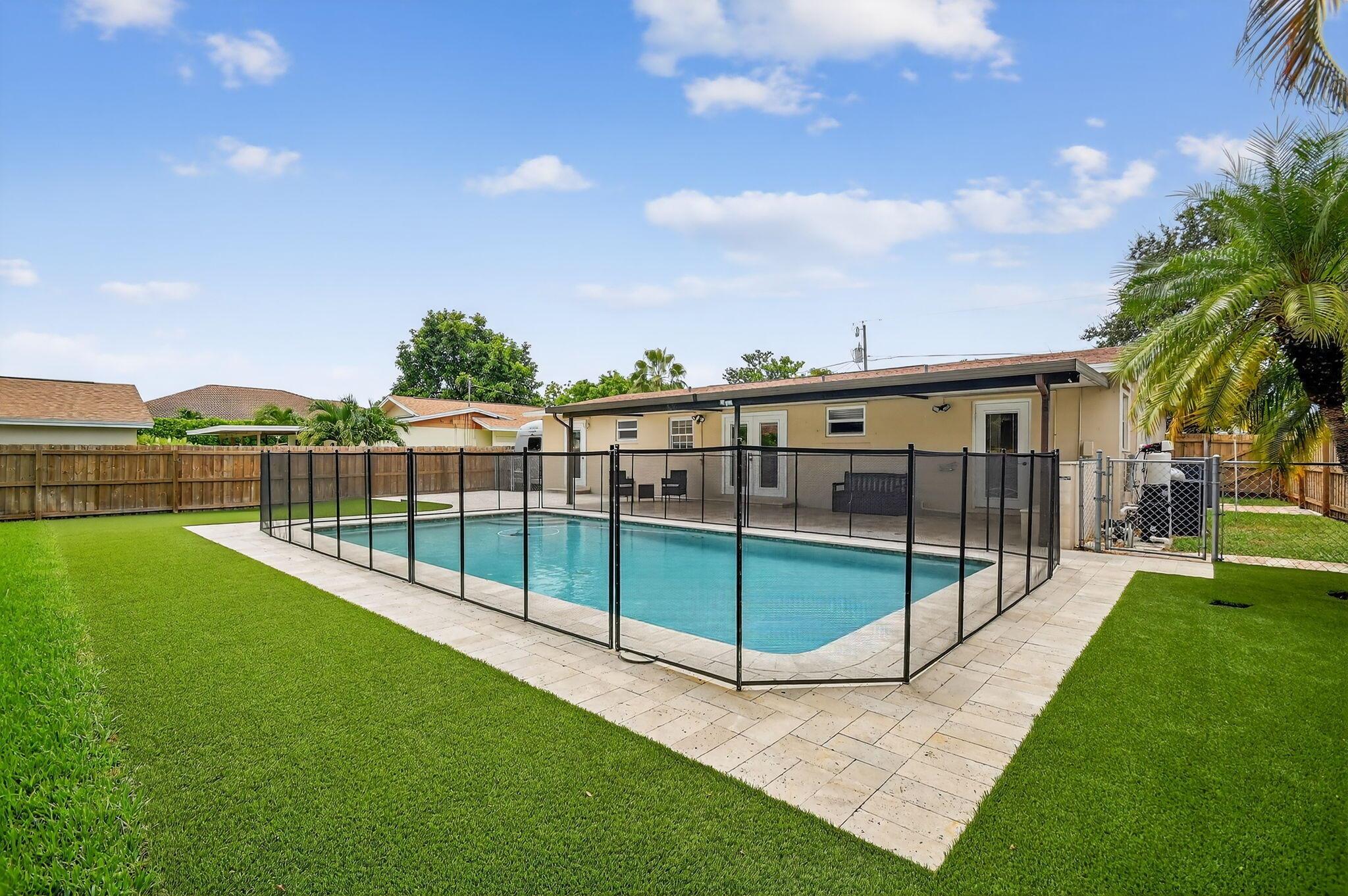 Beautiful 3-Bed, 2-Bath Pool Home on Oversized Lot! No HOA!This charming 1961-built home offers 1,618 sq ft of living space on a rare 0.28-acre lot near the end of a quiet dead-end road--providing privacy, less traffic, and a safer setting. Step outside to a large 15' x 30' sparkling pool with nearly 500 sq ft of travertine patio, surrounded by a privacy-fenced backyard--perfect for entertaining or enjoying your own tropical oasis. Large driveway, room for RV or boat! Roof 2020, A/C 2023, New Pool Pump 2025. Ideally located just minutes from PBIA, Palm Beach Island, and to Downtown West Palm Beach. Spacious layout with endless potential to update or customize. Offered at $624,900--your South Florida lifestyle starts here!
