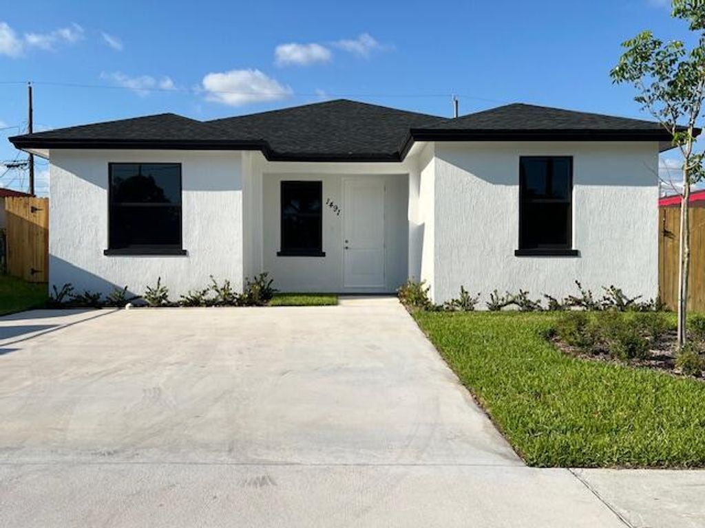Photo of 1491 W 30th Street, Riviera Beach, FL 33404 (MLS # R10992064)