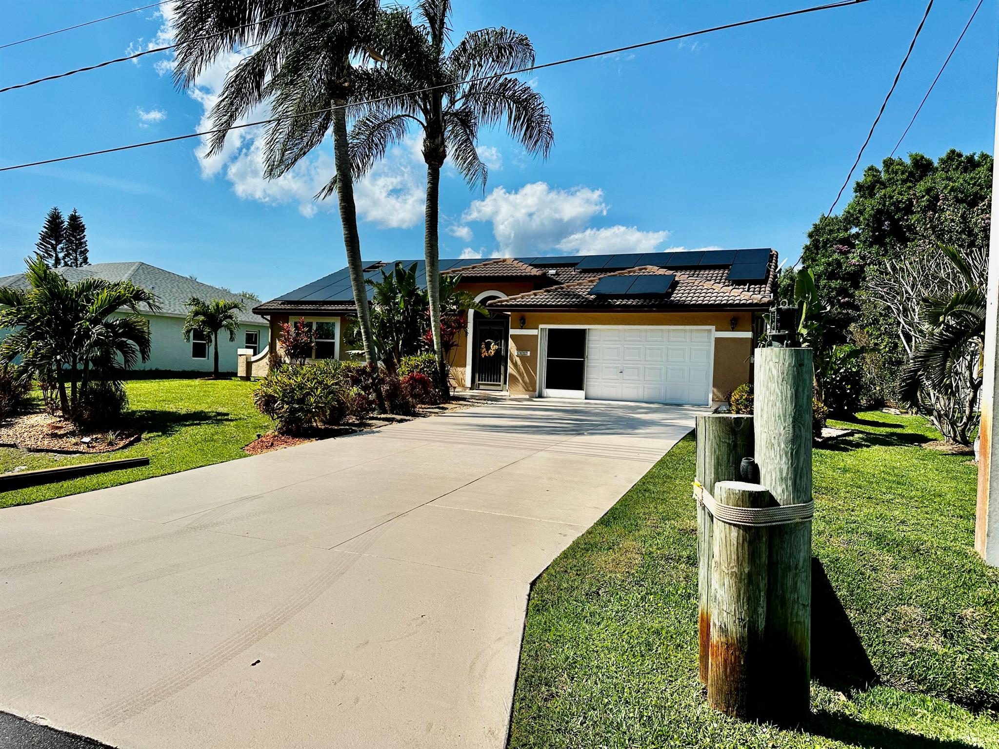 Waterfront Dream Home Alert!Spacious 1 story home!OCEAN ACCESS! New lighted Private Boat Dock & NEW 2022 Electric Boat LiftTerraced Backyard, New Pilings at DockNEW Hurricane Impact Windows throughout& New Water Heater (2022)Gorgeous Glass Front Door & Abundant Natural LightExpansive Screened-In Lanai & lighted In-Ground Pool...Solar Roof - SOLAR WILL BE PAID OFF BY SELLER! Seller's Electric bill is only $30.00 a month...New Appliances (Dishwasher, Range, Washer/Dryer), Ice Maker & Fridge in GarageLarge Owner's Suite with Pool ViewNew Fire Pit in lanai. Shower outside by the pool. Brand New Portable Generator included. Close to shopping, restaurants, beaches and moreConveniently located near 1-95 & the toll road Live the coastal lifestyle you've always wanted.