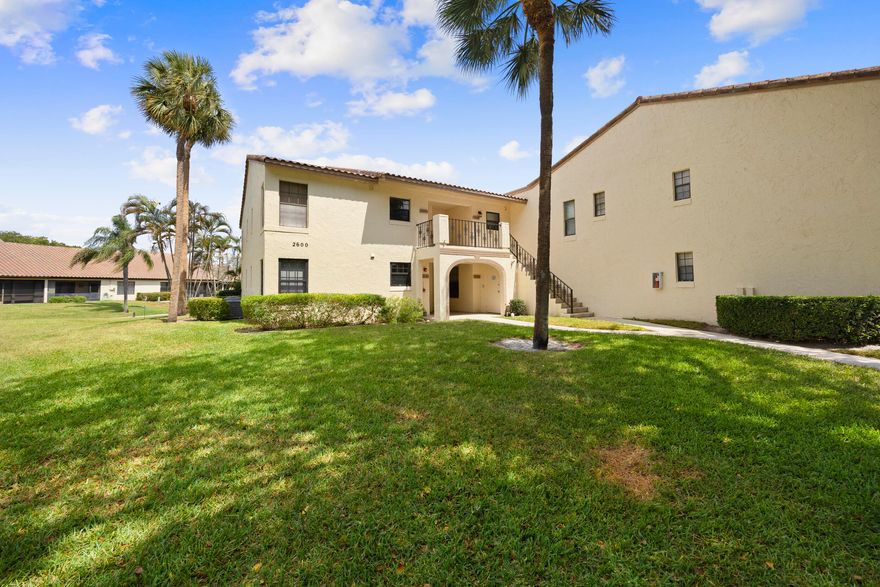 Opportunity knocks with lake views in the heart of Boca Raton. This 2 bedroom, 2 bath second floor condo in the gated Windwood community offers incredible value and the chance to create something truly your own.  Vaulted ceilings and a bright, open layout welcome you in, with natural light flowing throughout the living and dining areas. Step out to your private screened balcony and enjoy peaceful water views and a true South Florida feel. The split bedroom layout, walk-in closet, and in-unit laundry add everyday functionality and comfort.  Windwood is a beautifully maintained, tree-lined community known for its serene setting, walking paths, and resort-style amenities including multiple pools, tennis courts, and a clubhouse.  Unbeatable location just minutes to FAU, Lynn University, Town Center Mall, Mizner Park, I-95, and Boca's world-class beaches.  Whether you are looking for a full-time residence, seasonal getaway, or investment opportunity, this is your chance to step into Boca Raton at an attractive entry point and make it your own.