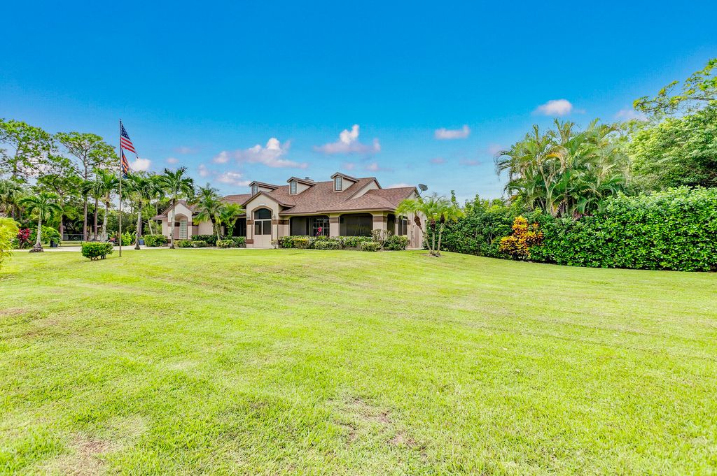 Photo of 16242 E Wiltshire Drive E, Loxahatchee, FL 33470 (MLS # R10840102)