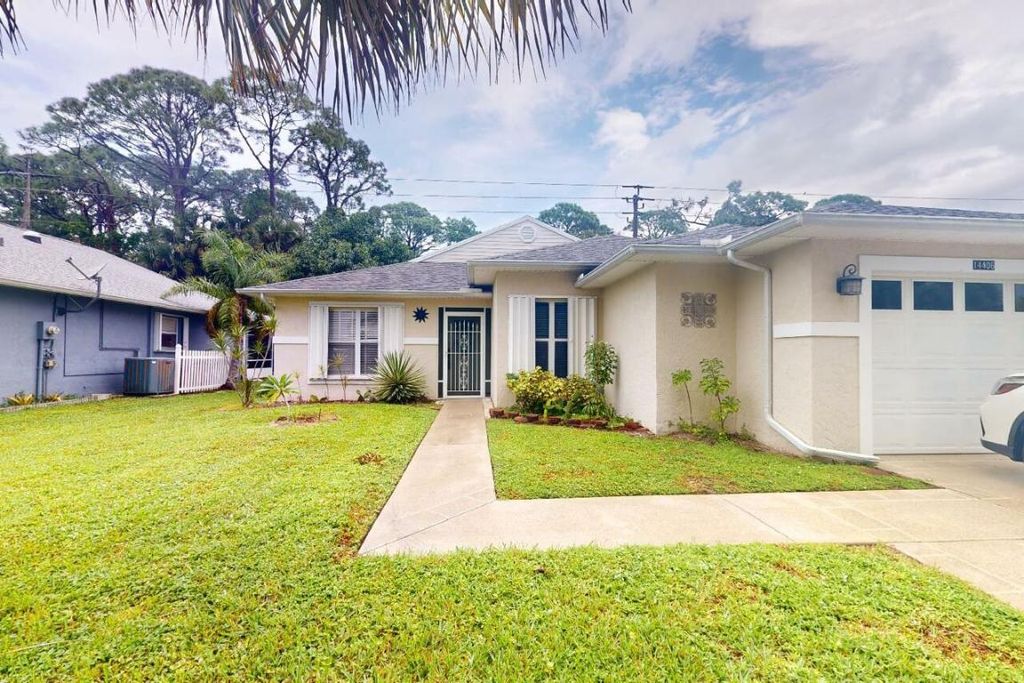 Photo of 14406 Aguila Ave, Fort Pierce, FL 34951 (MLS # R10928636)