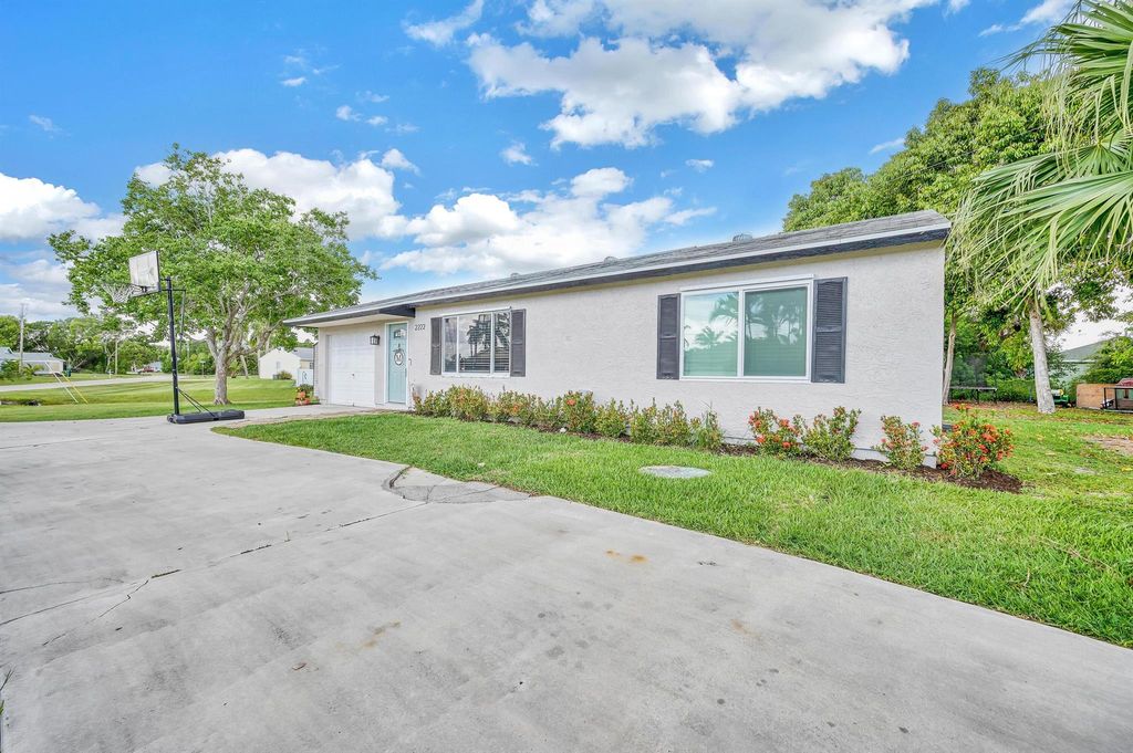 Photo of 2222 SE Rock Springs Drive, Port St Lucie, FL 34952 (MLS # R10890549)