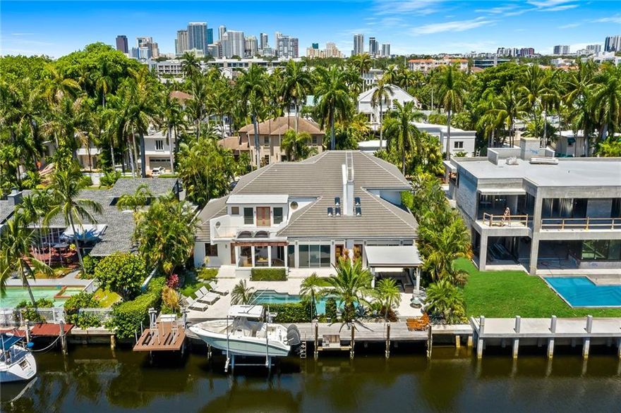 Architecturally gorgeous (!!) & meticulously maintained custom built home w 100' WF w direct ocean access!! Gracious open living/dining areas w soaring pecky cypress ceilings, central floating staircase & walls of glass extol the abundant natural light which fills this 5,540sf home. Bespoke cabinetry, dual fireplaces & wet bar in family rm compliment stunning new custom-designed gourmet kitchen (2019) which opens to spectacular gazebo/salt pool /gas summer kitchen. 1st flr has 2 private guest rms, cabana bath, butler’s pantry & laundry rm. Grand Primary Suite w/sumptuous spa bath; walk-in closet & dual terraces along w/2 additional private ensuite guest rms are situated on the upper level. Impact windows/doors, 2021 full house gas gen, 2018 roof, 3 car garage, 12K boat/ 7K jet ski lifts!