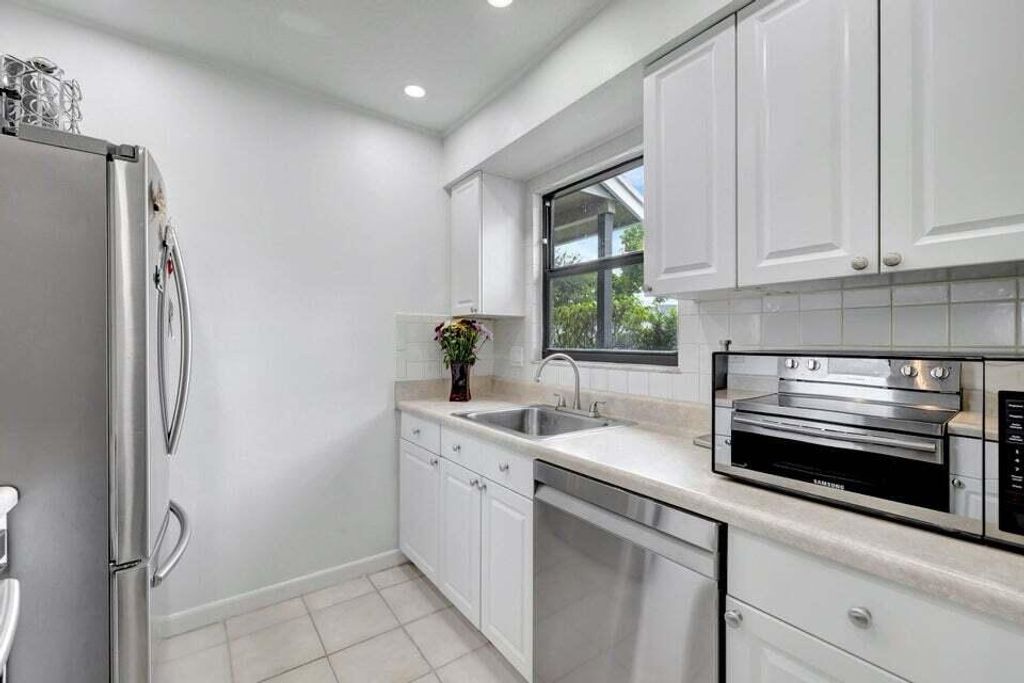 Photo of 5903 Channel Drive, Greenacres, FL 33463 (MLS # R11123786)