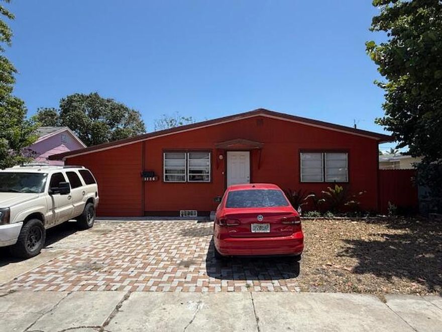 Spacious and open living room area connected to 2 large bedrooms and 2 full baths.  Updated kitchen with island and dining area.  Recently installed vinyl tile flooring throughout.  Laundry room with washer & dryer.  Huge fenced rear yard that has plenty of room for a pool.  ATTACHED CARPORT CONVERTED INTO STUDIO APARTMENT WITH PRIVATE SIDE ENTRY...CREATES EXTRA CASH OPPORTUNITY!!  No HOA...PERFECT FOR INVESTOR!!