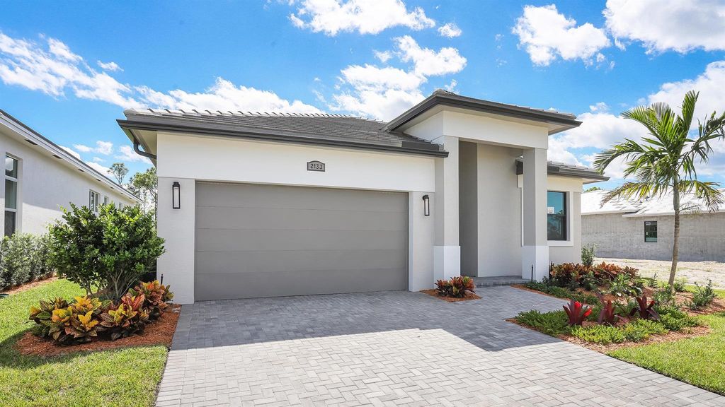 Photo of 2133 SE Mosaic Boulevard, Port Saint Lucie, FL 34984 (MLS # R10938785)