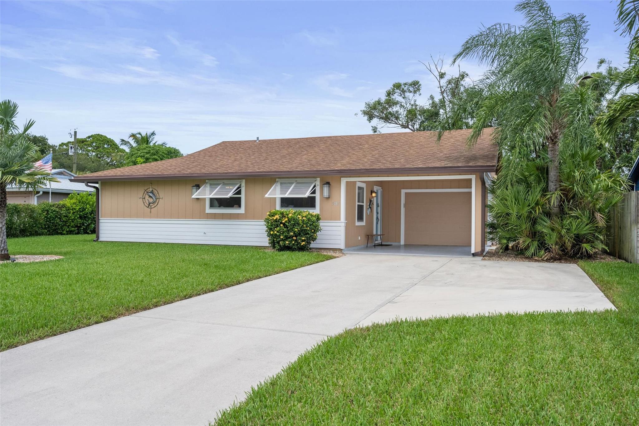 Welcome to this beautiful Florida style ranch home. You’ll be greeted by a water fountain and pond as you approach this unique 2-bedroom, 1.5-bath home with potential for a 3rd bedroom. Enjoy modern upgrades like barn doors and a custom live-edge rosewood counter. Spacious primary bedroom has an on suite room perfect for a nursery, office, or exercise room as well as 2 huge walk-in modular closets. Second flex room off the living room. Boaters and RV owners this is your dream setup! There is a side parking with over 40+ ft. Low HOA that includes a clubhouse. AC 2023!
Don’t miss this rare blend of charm just minutes from fishing, boating, golfing, beaches, and biking. Minutes from quaint Port Salerno, Manatee Pocket, downtown Stuart, and the I95.