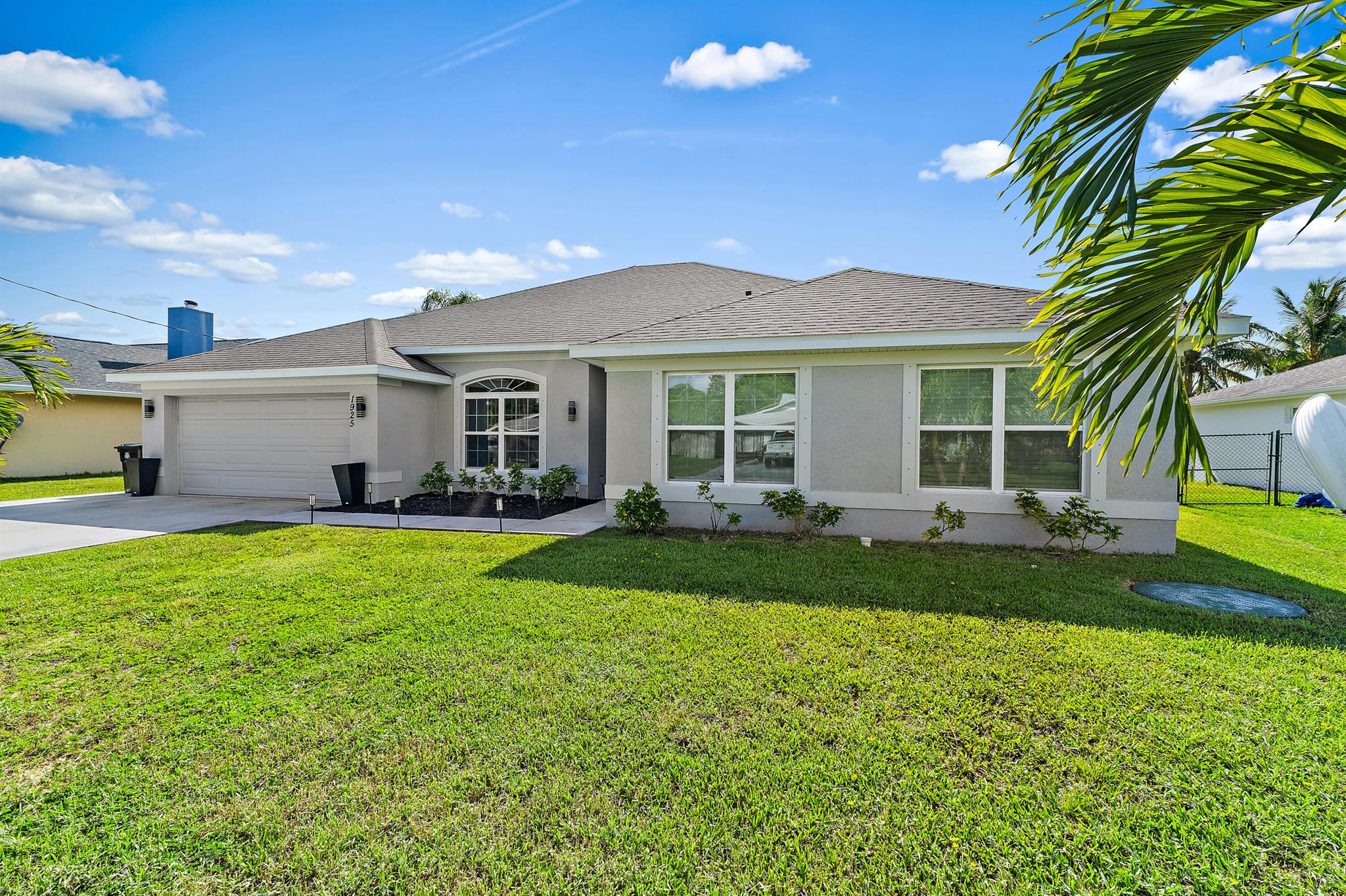 Discover 1925 SE Mantua Street, a beautifully maintained home built in 2020 and now available in a desirable Port Saint Lucie neighborhood. This spacious 4-bedroom, 3-bathroom single-family residence offers 2,961 square feet of comfortable living space, providing ample room for everyone.Step inside to experience a bright, inviting, and open layout that perfectly blends functionality with modern style. The well-appointed kitchen is ready for your culinary adventures, while each of the four bedrooms offers a peaceful retreat. With three full bathrooms, convenience and privacy are ensured for all residents.