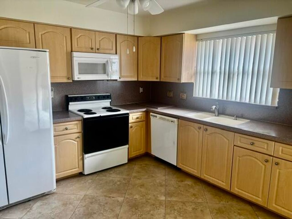 Photo of 9890 Bischofia Tree Way #B, Boynton Beach, FL 33436 (MLS # R11163731)