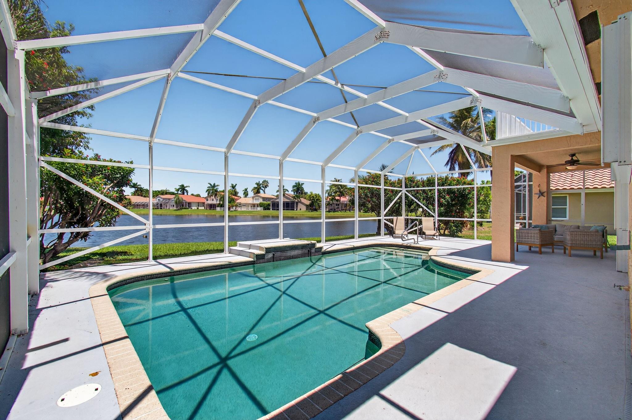 Gorgeous 4 Bedroom/3 Bathroom Lakefront Residence With A 3-Car Garage In The Prestigious Gated Community Of Boca Isles North! Step Inside & Be Welcomed By Expansive Water Views, Soaring Windows That Fill The Home With Natural Light, & An Open Concept Layout Perfect For Modern Living. The Renovated Kitchen Features Sleek European-Style White Cabinetry, Quartz Countertops, And & Stainless Steel Appliances. Premium Flooring & Recessed Lighting Enhance The Elegant Feel Throughout. The Luxurious Primary Suite Boasts A Generous Walk-In Closet & An Incredible Oversized Balcony Overlooking The Lake.. This Home Truly Checks All The Boxes – Located In A Top-Rated School District And Offering Resort-Style Amenities Including Clubhouse, Fitness Center, Pool, Tennis, & More!