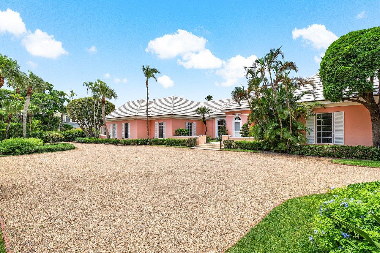This never before offered property is one of the few homes sitting directly on Fairway 5 of the renowned Jupiter Island Club. Set on .63 acres, this Bermuda-style estate includes 7 bedrooms and 7 bathrooms spanning the in house and a separate guest house, added in 1990. With breathtaking views of the golf course and vibrant sunsets, this property provides a rare opportunity for someone seeking both privacy and the ability to entertain on a grand scale. While largely original, the home's generous footprint and timeless style provide an ideal foundation for a thoughtful renovation or a bespoke new build.