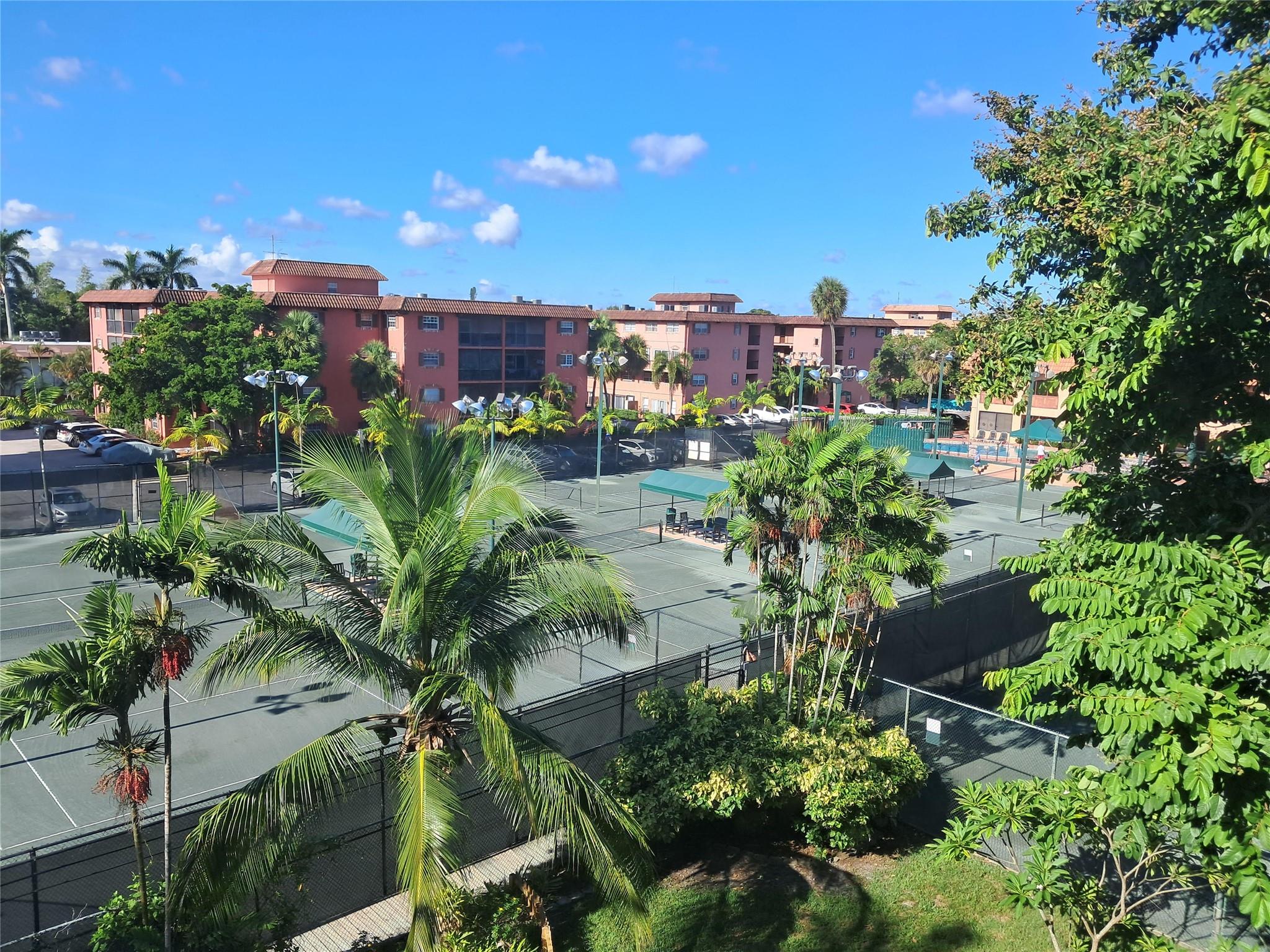Located in the famous Tennis Club of Fort Lauderdale along the Middle River, this updated townhouse-style Apt., has a fabulous balcony view of the tennis cts. & clubhouse. Vinyll plank flooring throughout, makes for a very clean-looking Apt. Open Kitchen with seperate dining area. Lge bright living room has a spiral staircase leading up to 2 roomy split bedrooms, with an updated bathroom in between. The Apt. is literally a step away from 20 clay tennis courts (10 Lighted), 3 hard cts., heated pool & spa, fully equipped gym, plus a full service patio bar & grille- all reachable via an adjacent private walkway. Gated 24/7 makes you feel so safe here. Close to Wilton Manors, downtown Ft Lauderdale, & beautiful beaches. It is Ft Lauderdale's best kept secret. You'll love it here!