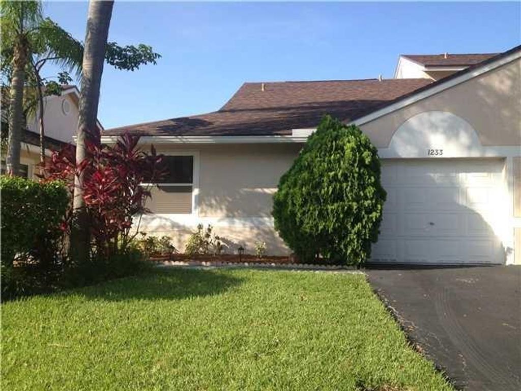 Photo of 1233 NW 52nd Way, Deerfield Beach, FL 33442 (MLS # F10384204)