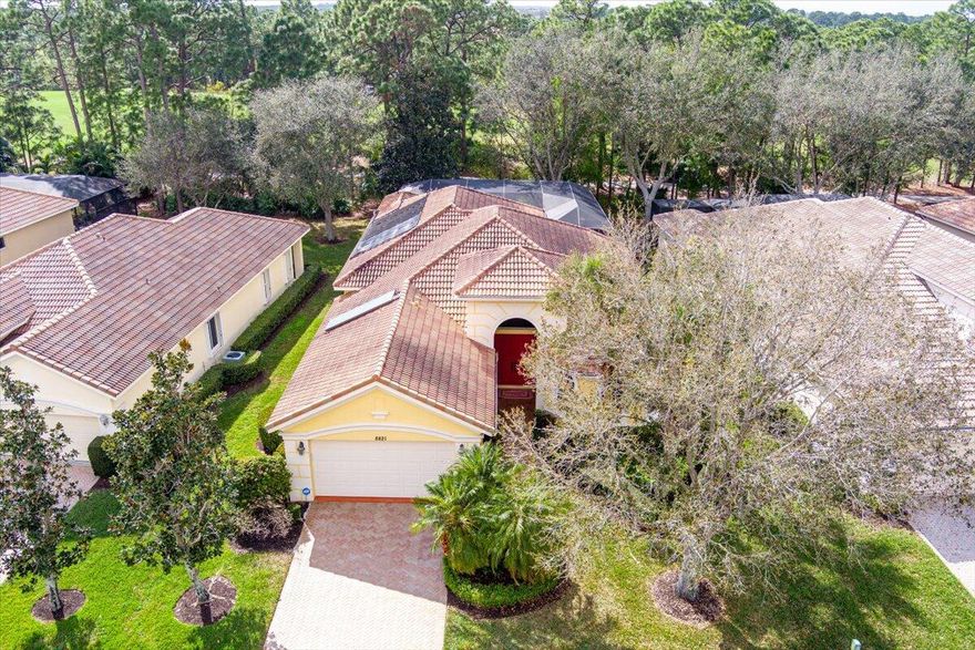 Tee up your Florida lifestyle at 8821 Champions Way in the prestigious PGA Village.  Fully furnished and move-in ready, this 3 bedroom, 3.5-bath home offers over 2,300 sq. ft. of bright, open living space overlooking the golf course.  Step outside to your private solar-heated, screened-in pool with cabana bath, or fire up the brand-new outdoor kitchen ,complete with sink, ice well, grill, and granite seating for six, perfect for post-round gatherings.  Inside, soaring 15' ceilings, oversized 12' sliding glass doors, and tile flooring throughout create a light, airy feel. The chef's kitchen boasts granite countertops, 42'' cabinets, stainless-steel appliances, plus a reverse osmosis system at the sink for pure, great-tasting water. The spacious primary suite features dual sinks, a soaking tub, and a separate shower, while peace-of-mind upgrades include a brand-new hot water heater and a whole-house water filtration system.  Located in The Lakes at PGA Village, you'll enjoy a clubhouse, fitness center, and resort-style pool, with optional memberships available to the PGA Golf and Social Club. Just minutes from I-95, shopping, and dining, this home is your ticket to championship living.  Bring your bathing suit, toothbrush, and golf clubs, your Florida dream starts here!
