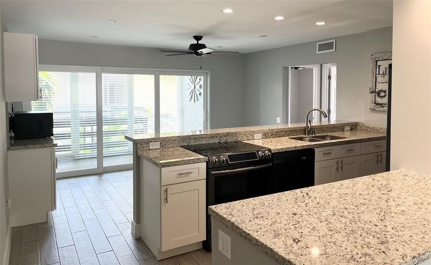 Renovated 3/2 top floor corner unit in gated community east of I95. All impact windows and double impact sliding doors . Open kitchen with soft close cabinets/drawers, granite counters & double basin stainless sink. Black stainless appliances, Large size washer/dryer. Wood-look tile through the entire home including the fully enclosed balcony. No popcorn, no carpet, & split floor plan! Bathrooms are updated with modern tile accents. Master bed has a sliding barn door to the en suite bathroom. Nest thermostat, Hunter ceiling fans. Community has 2pools, clubhouse, and fitness center. Walking distance to Publix, YouFit, restaurants. Pet is welcome. Per Association min 650 credit score.