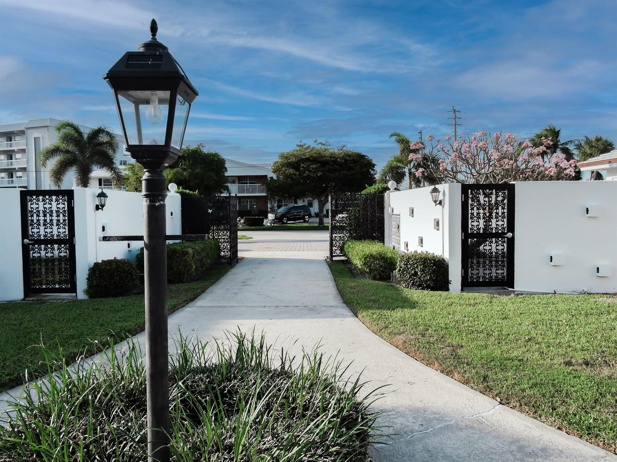 Come home to this lovely renovated ground level condominium! Across the road from the stunning NPB Country Club and convenient to wonderful North Palm Beach restaurants and shopping, this unit is one of a kind. It boasts an enormous screened-in, covered patio as WELL as a beautiful private courtyard for anyone from avid gardener to dedicated sun-bather to revel in! The renovated space offers a bright white kitchen with glamorous touches and easy-care wood-look flooring. Stackable washer and dryer and dedicated laundry room make chores a breeze. Enjoy the Florida lifestyle in a home you'll never want to leave!Available August 1.