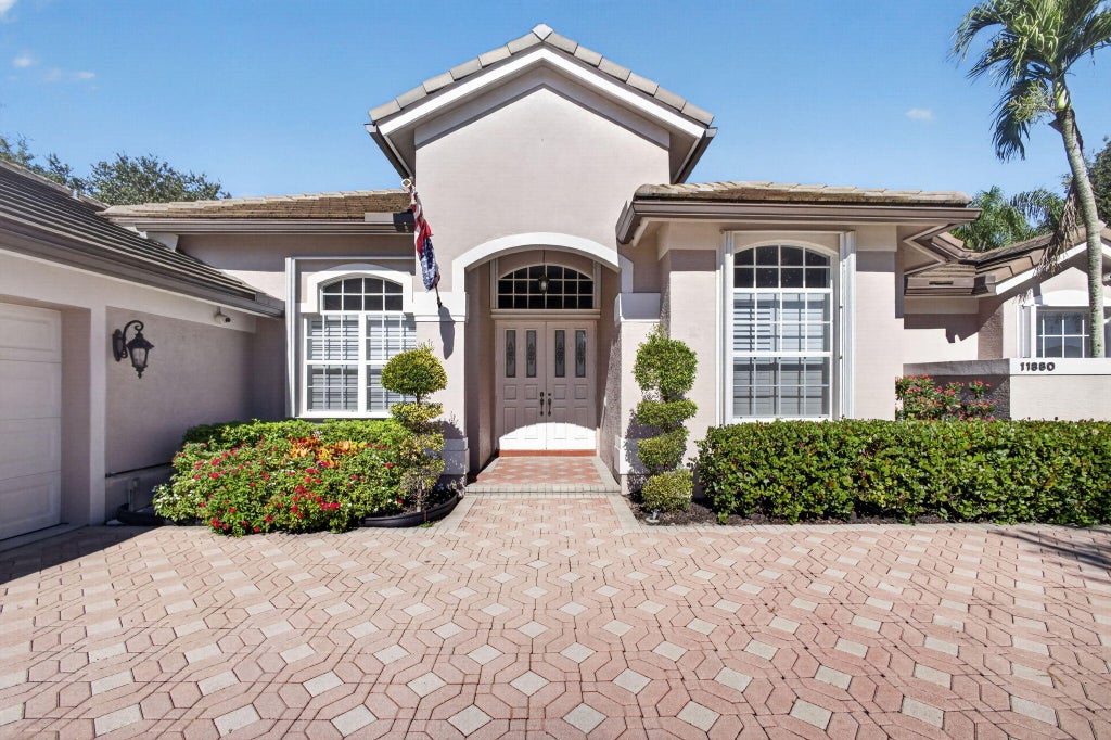 Photo of 11880 TORREYANNA Cir, Palm Beach Gardens, FL 33412 (MLS # B26088194)