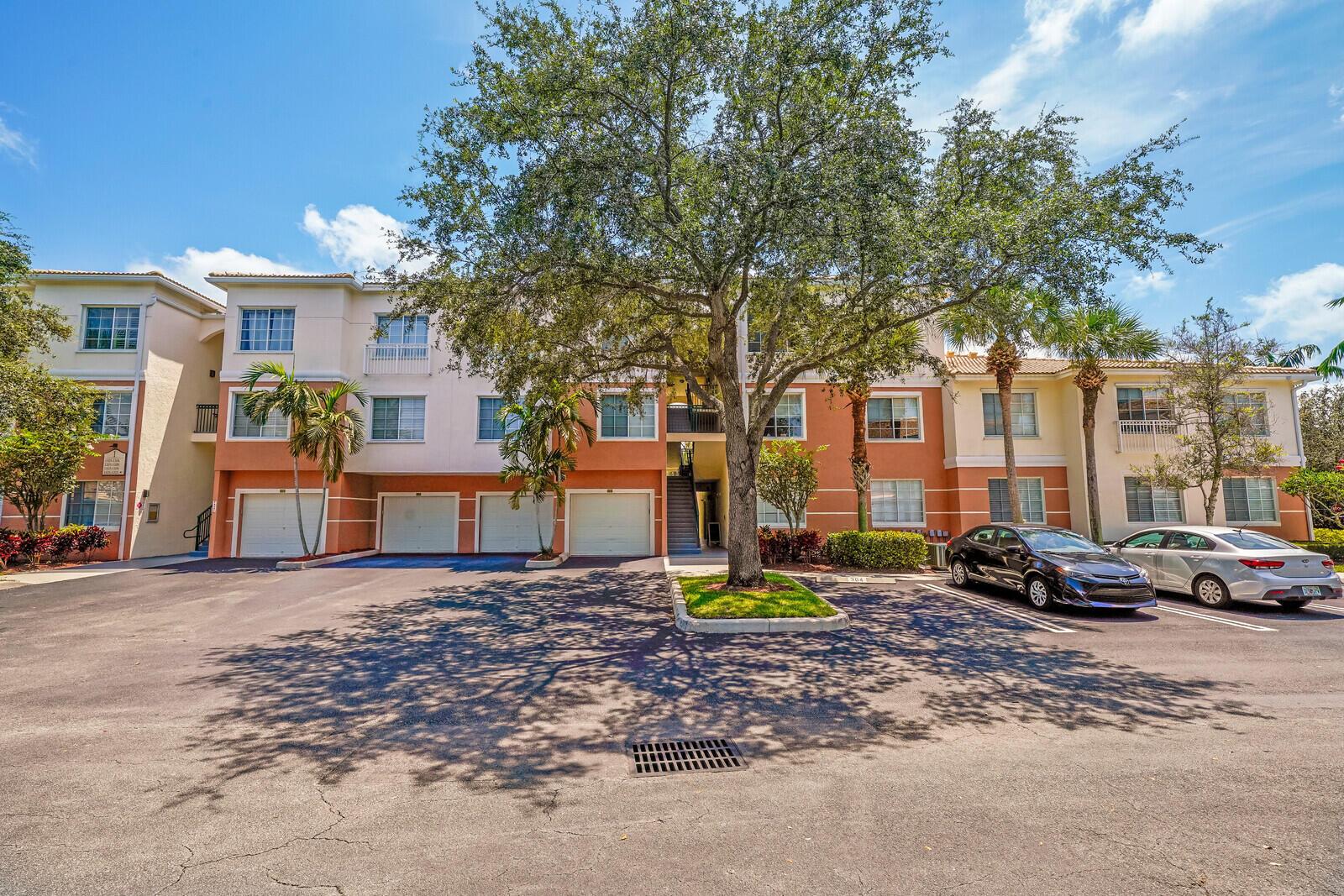 CAN BE RENTED UNFURNISHED OR FULLY FURNISHED WITH IMMEDIATE AVAILABILITY! Beautifully updated one bedroom rear unit in secure, fully gated community at desirable Fiore At The Gardens. Serene, tree lined views from private balcony with no rear neighbors. Fabulous HOA amenities include resort-style pool, gym, clubhouse, playground, carwash and full time on-site manager. Complete with in-unit washer & dryer, fully equipped kitchen, spacious bedroom with walk-in closet, bright living/family room with glass doors leading to balcony. Great location near Alton shopping center & restaurants and just minutes from the beach.