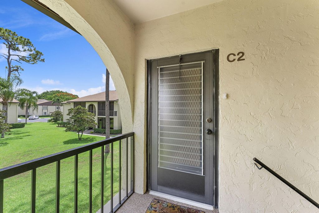 Photo of 301 Knotty Pine Circle #C-2, Greenacres, FL 33463 (MLS # R11103864)