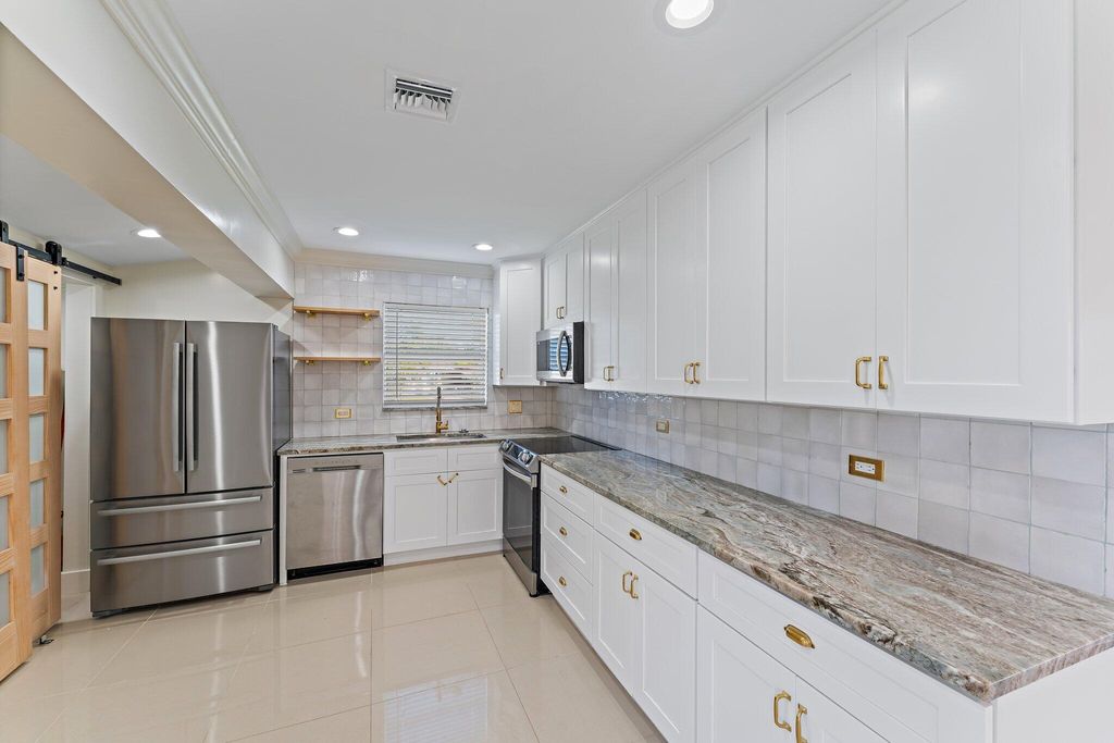 Photo of 12149 Colony Avenue, Palm Beach Gardens, FL 33410 (MLS # R11092344)