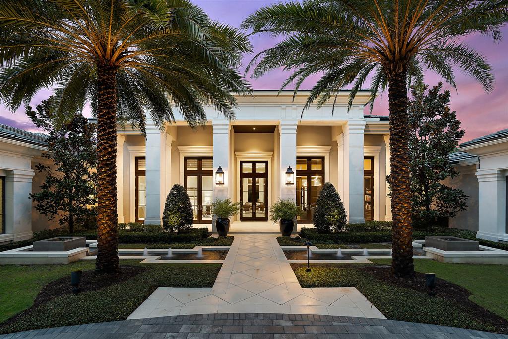 Stunning Regent Model Home is nestled on a secluded acre in the desirable Custom Estate section of Old Palm Golf Club. This beautiful transitional open floor plan is 2015 built & interiors designed by renown Courchene Dev. European white oak wood & marble floors throughout. Quality permeates this spectacular residence complete with club room, custom wine room & wine gallery, indoor&outdoor natural gas fireplace. Generous master BR, his/her baths with access to your private oasis & heated pool & spa. Her bath has an indoor&outdoor shower w/natural pebble floor & wall. Her dressing room 15x14 has plenty of hanging space, shelves & built-in island cabinetry. His & her office, 5 car A/C garages. WH Generator, Close to the best of everything the Palm Beaches has to offer. This is a must see!