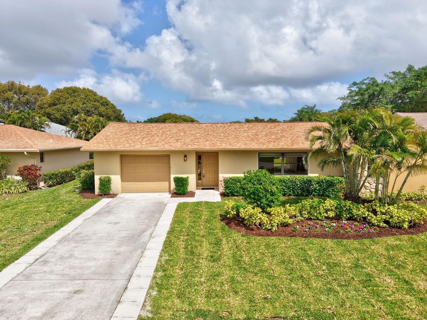 Enjoy your Florida lifestyle in this very active community that is also so close to Atlantic Avenue and all that it has to offer. This is a move in ready home! New floors, kitchen with beautiful quartz countertops and stainless steel appliances, freshly  painted and more! This centrally located house has been lovingly restored and has a 2020 roof and 2022 A/C . Included in your HOA is roof replacement, home painting, 5 heated pools, 8 tennis courts, a theater, gym in a gated community. Easy to show!
