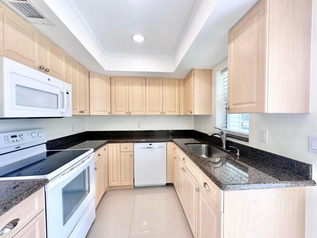 Photo of 10193 N Military Drive #203, Palm Beach Gardens, FL 33410 (MLS # R11005606)