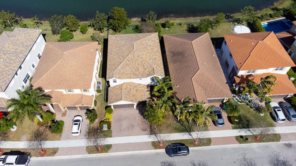 Photo of 9911 S Miralago Way, Parkland, FL 33076 (MLS # B26032256)