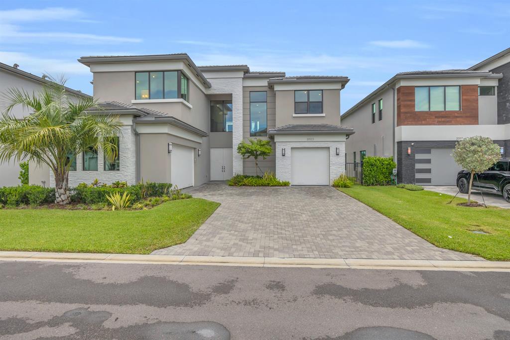 Welcome to this stunning residence in the highly sought-after Lotus Palm community of Boca Raton. This expansive 6-bedroom, 7-bathroom single-family home combines modern luxury with timeless elegance, offering the perfect retreat for sophisticated living.Designed with meticulous attention to detail, this home boasts all available upgrades, featuring an open-concept floor plan, soaring ceilings, and abundant natural light. The gourmet chef's kitchen is a true centerpiece, appointed with Italian marble countertops and full marble backsplash, top-of-the-line appliances, and a spacious island ideal for entertaining.