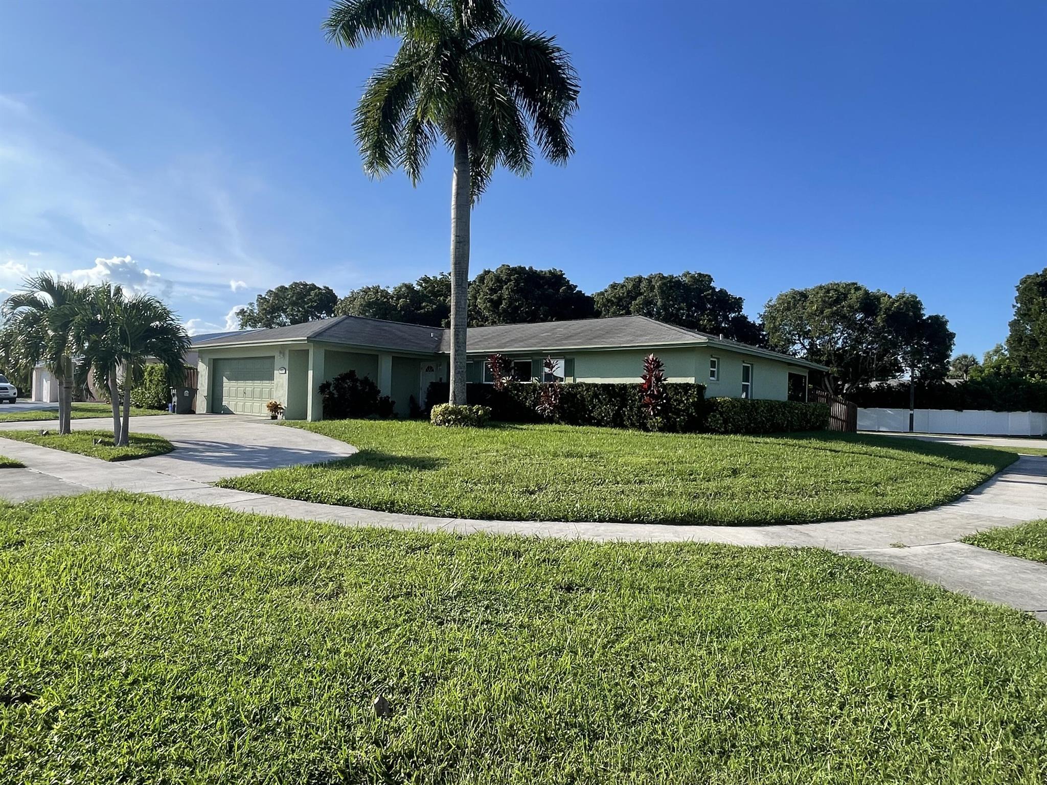 **MOTIVATED SELLER** Come see this beautiful 3/2/2 corner lot single family home in the quiet Foxwood Estates neighborhood. It features a renovated kitchen with custom wood cabinets and granite countertops, tile and laminate flooring in living areas, carpet in the master bedroom, and a convenient laundry room. Enjoy the fenced in backyard with a large screened-in patio. Low HOA fees, and a prime location just 5 miles from I-95, 10 minutes from the Turnpike, and close to downtown West Palm Beach/City Place! Nearby schools include Bear Lakes Middle School, Palm Beach Lakes Middle, Jeaga Middle School, Oxbridge Academy, and Cardinal Newman High all less than 5 miles. Rentals allowed (just no AirBNB's). Owner-occupied. Pets on premises. Showings by appointment only!