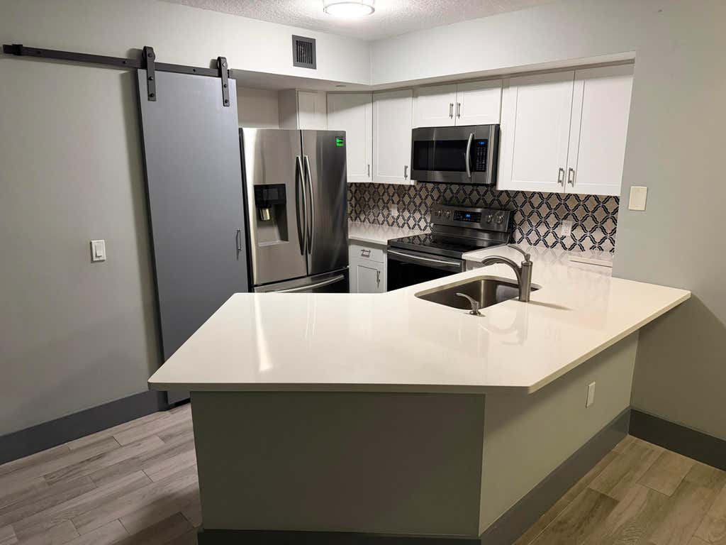 Photo of 4211 San Marino Boulevard #105, West Palm Beach, FL 33409 (MLS # B26016721)