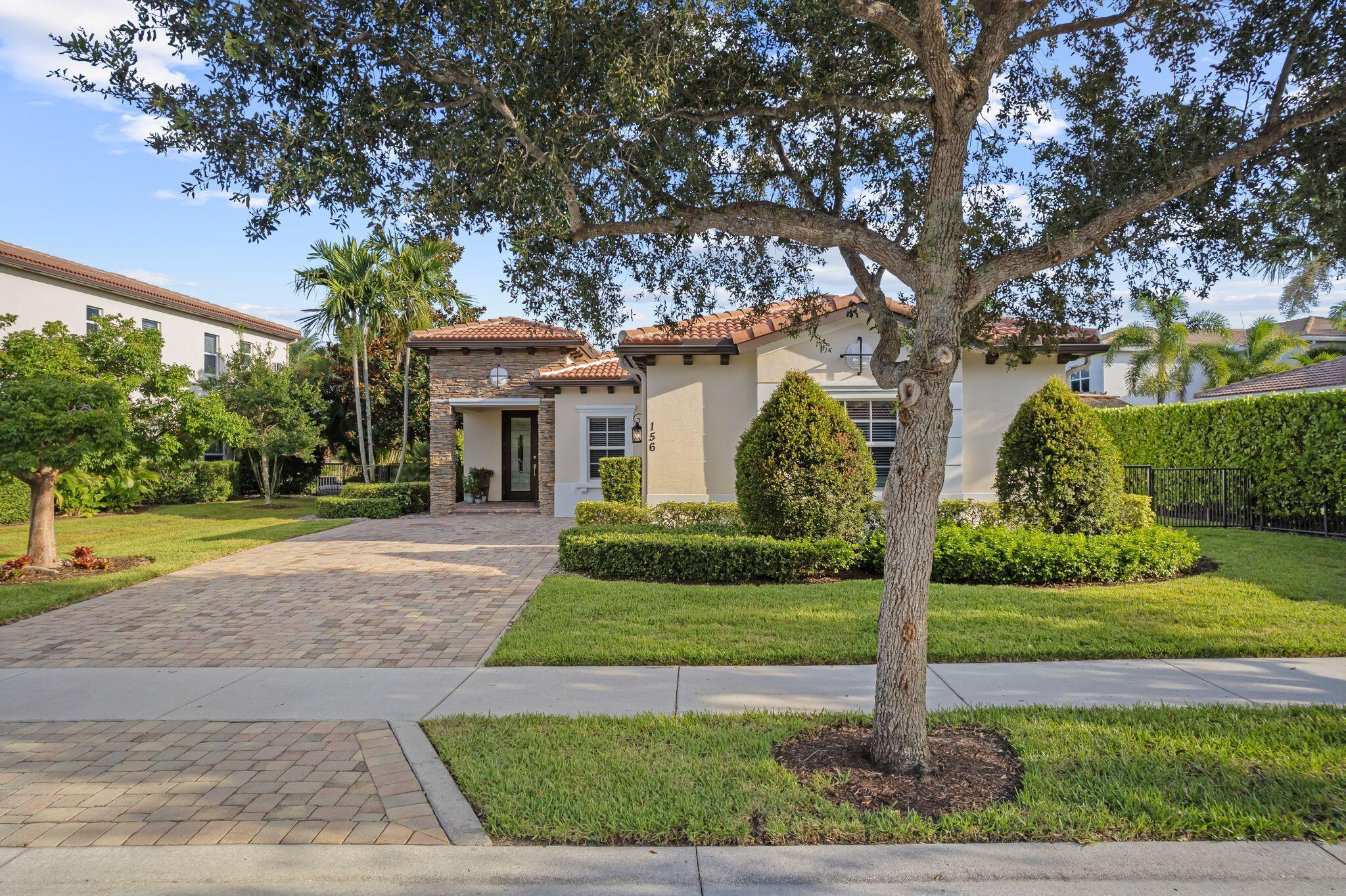 Located in the highly desirable gated community of Rialto, this beautifully upgraded 4 bedroom, 2.5 bath home offers a perfect blend of comfort, style, and functionality - all overlooking a serene water view!The backyard is a true retreat, featuring a 32' x 14' saltwater, heated pool and 7' x 8' spa with waterfall spillover, sun shelf, deck jets, deep-end bench seating, and jets on both top and bottom. Built in 2022 by CSE Paving of Florida, Inc., the pool area is finished with elegant sandblasted marble decking in a French pattern and includes Aqualink smartphone automation. The fully fenced yard with a self-locking gate and child safety alarms on all windows and doors make it ideal for families with children or pets.