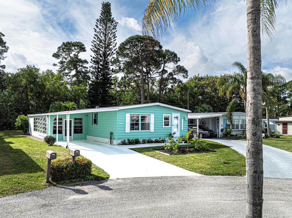 Photo of 14 SE La Mesa Lane, Port Saint Lucie, FL 34952 (MLS # R10954137)