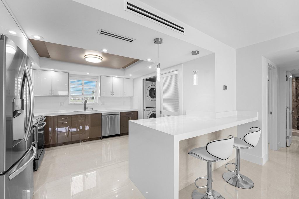 Photo of 301 Lake Shore Drive #411, Lake Park, FL 33403 (MLS # R11130410)