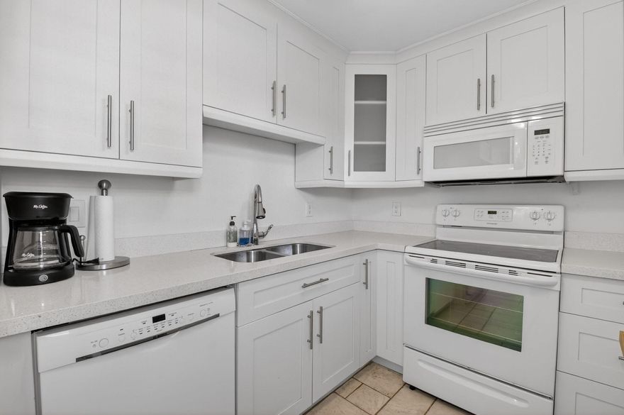 Discover coastal living at its finest in this beautiful, light-filled, impeccably maintained 2-bedroom, 2-bathroom condo just steps from the sandy beach! Located on the second floor, this move-in-ready unit features tile flooring throughout, an in-unit washer and dryer, and an updated kitchen complete with a window for added natural light. Offered fully furnished, it's perfect as a primary residence, vacation home, or investment opportunity. The spacious living and dining area opens to a large screened-in balcony overlooking the pool-ideal for relaxing or entertaining. Enjoy a prime location with easy beach access, nearby shopping, and excellent dining options. Just a short walk to local attractions and only 15 minutes from the airport.