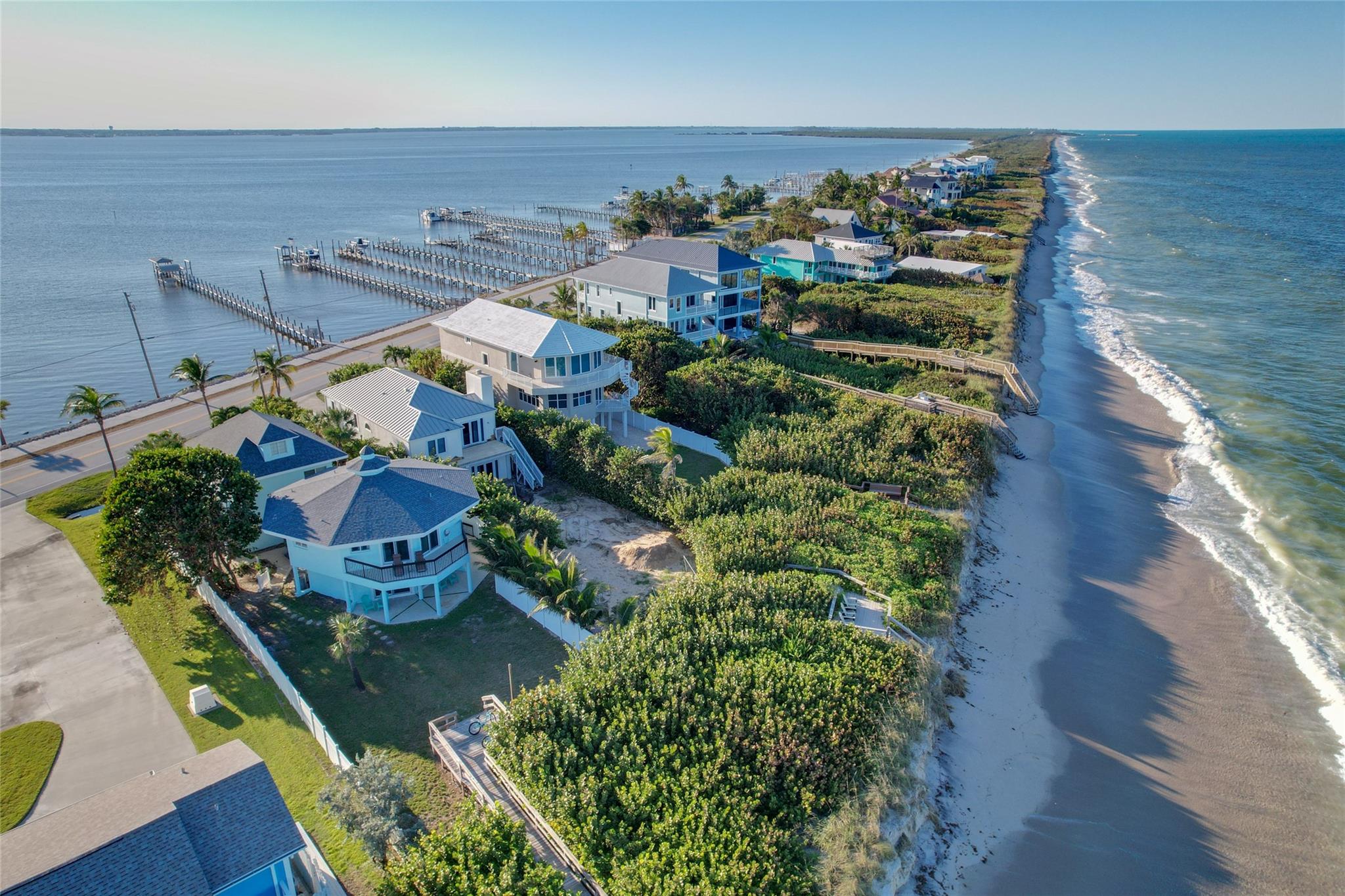 This beautiful Oceanfront to River property with a new 4x360 dock and 10x16 terminus has impact windows and sliding doors with amazing sunrise views over the ocean and river sunset views complete with a guest apartment over the garage. The main property has 3 ensuite bedrooms with a half bath downstairs. The apartment has a full kitchen with a bedroom and full bath.