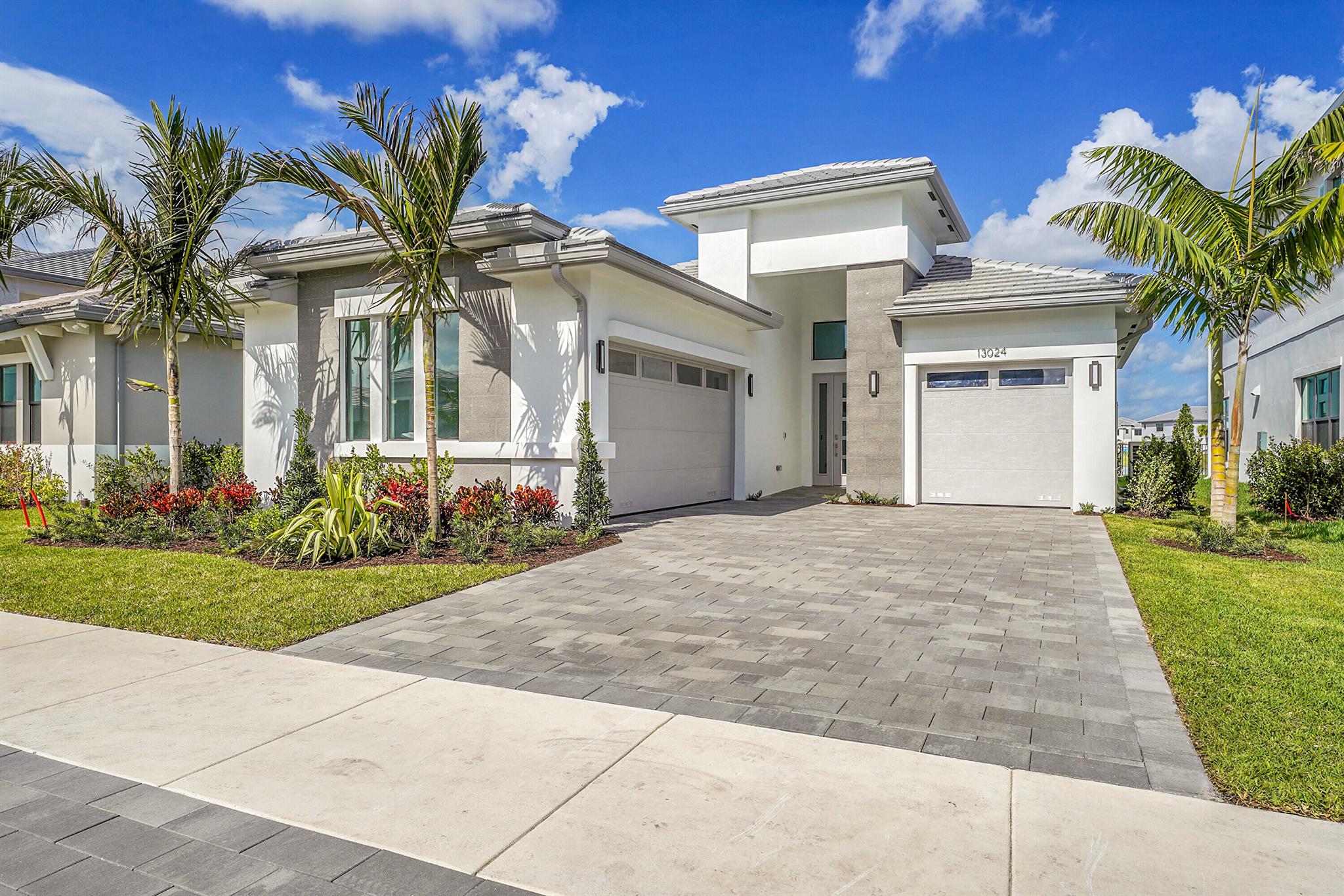 3-bedroom plus den, 3.5-bathroom home. Florida lifestyle. Sunlight streams through the open floor plan, creating an airy and welcoming ambiance that's perfect for everyday living and effortless entertaining. This property offers the convenience of an attached 2-car garage and the coveted Palm Beach Gardens location. You'll be just moments away from world-class shopping, dining, entertainment, and top-rated schools. New Club house open in fall 2025 Clubhouse giving residents access to a full-service restaurant and poolside bar, 3 separate pools, fitness center, covered playgrounds, indoor and outdoor social spaces, sports courts and more.