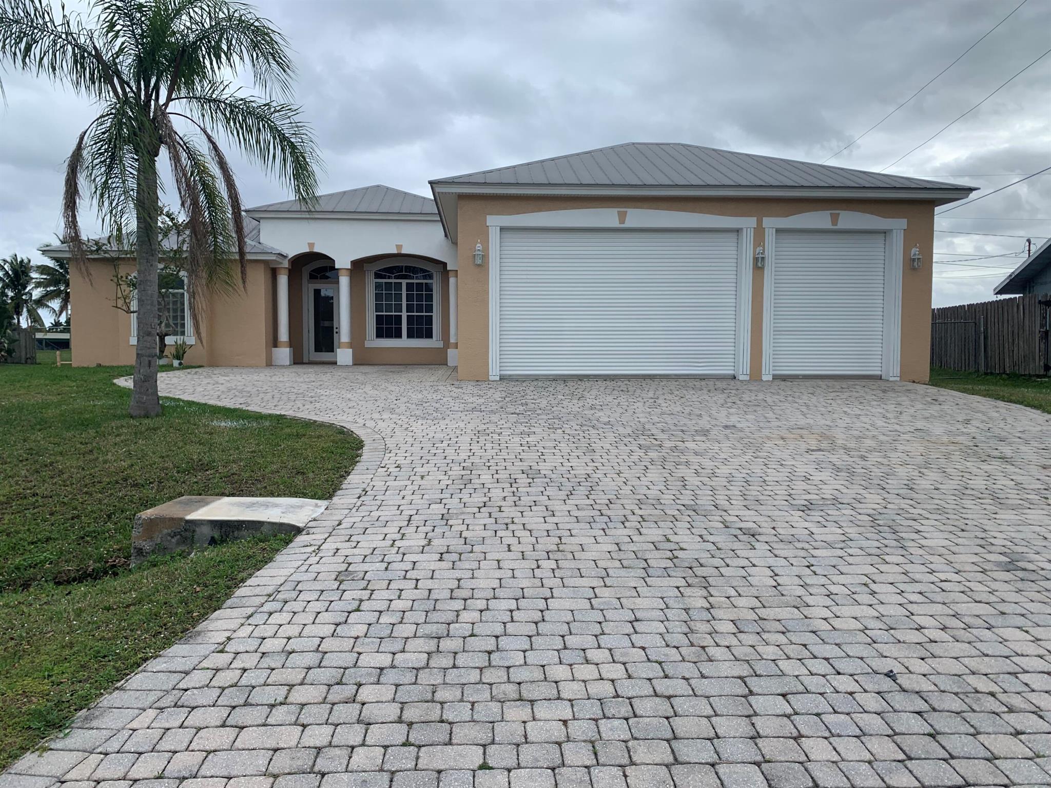 Custom Built Luxury Pool Home, Ocean Access 152 FT Water Fronton on the deep and wide C-24. Beautiful view on .5 acres lot. Bridge Clearance at the South-Bend is 18 feet, many large boasts in this area, 25 min to the inlet. Metal Roof. 2701 SQ living area and 6732 SQ total area. Front and the back porch, 3 commercial size car Garage. 4 spacious bedrooms and 3.5 bathrooms, this home is perfect for growing families or those seeking ample space for guests and hobbies. 🛀 Relax and rejuvenate in the comfort of your own private water front ocean access, offering a touch of luxury and privacy for its lucky occupant.Relax and rejuvenate in the comfort of your own private water front ocean access, offering a touch of luxury and privacy for its lucky occupant.No need to worry about par