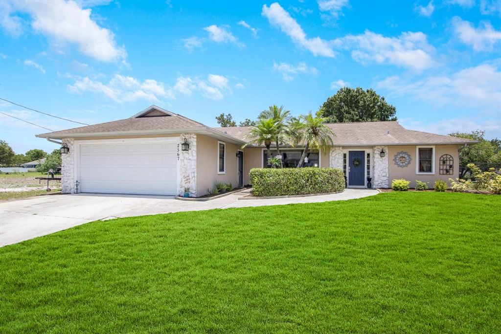 Photo of 2567 SW Chestnut Lane Ln, Port Saint Lucie, FL 34953 (MLS # R10811061)