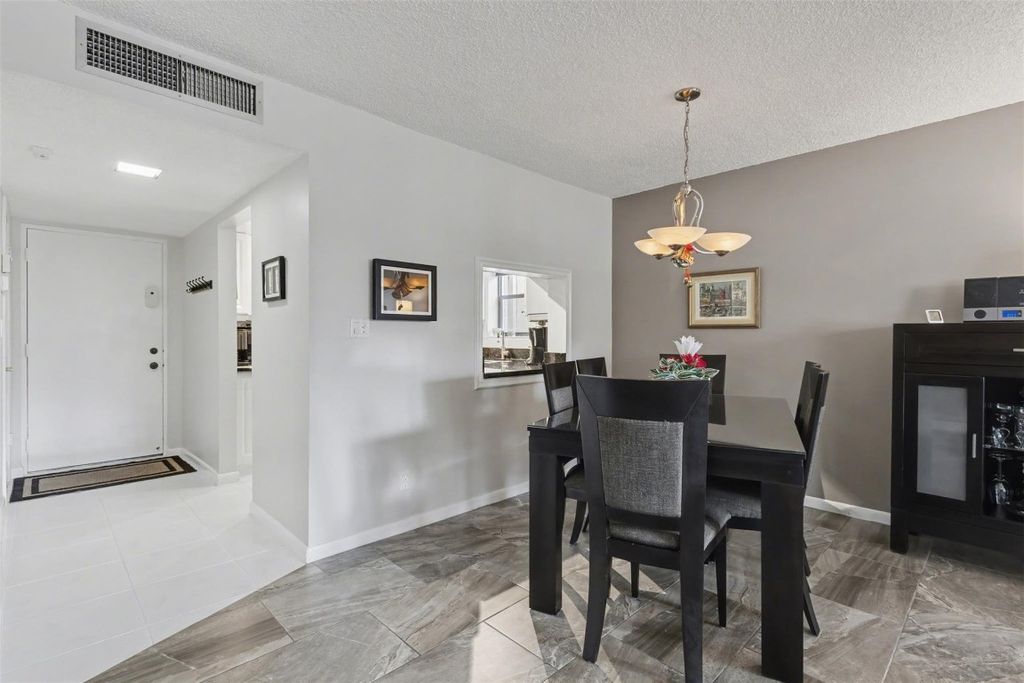 Photo of 2307 S Cypress Bend Drive #106, Pompano Beach, FL 33069 (MLS # F10542615)