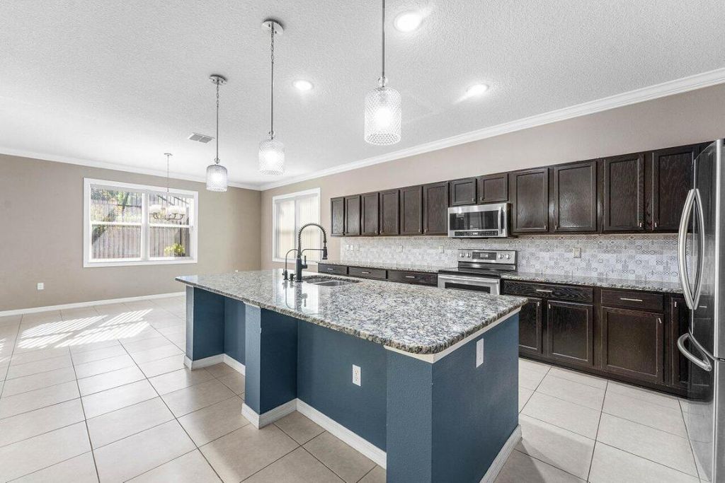 Photo of 1842 SW Lofgren Avenue, Port Saint Lucie, FL 34953 (MLS # R11150523)