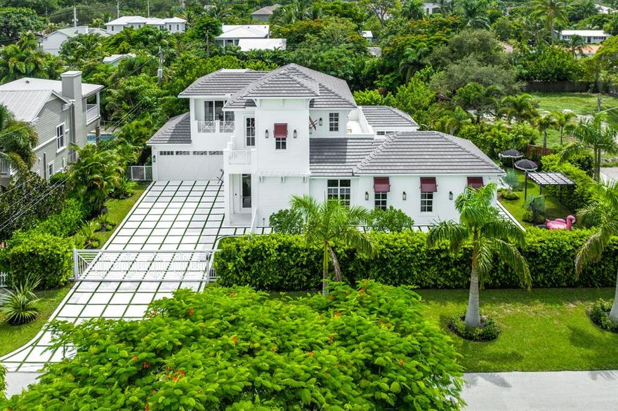Remarkable re-imagined modern farmhouse-inspired residence on an oversized corner lot in desirable downtown Boca Raton. Resort-like pool/patio with spa and lanai for entertaining. Natural gas for the commercial Viking cooktop and whole house generator. Professionally designed. An absolute one of a kind design and Layout with Flow. Entire Smart Home system with security. Please see attachment for all the features and upgrades owner added.