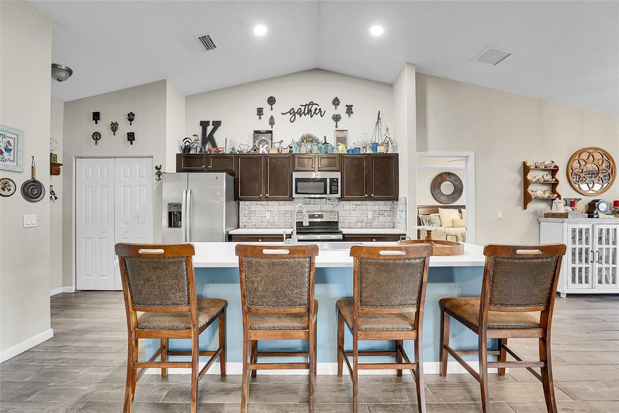 Welcome to your dream home! This stunning 4-bed, 2-bath residence, newly built in 2021, sits on a desirable corner lot with a spacious fenced yard—ideal for entertaining or adding a pool. The split floor plan offers seamless flow, with wood-look tile flooring and an open kitchen featuring modern finishes with ample counter space for your cooking pleasures. Enjoy the covered patio, 2-car garage, hurricane-safe with shutters and impressive curb appeal. Tastefully decorated and feels like a true home. No HOA means true freedom. Don’t miss this rare blend of style, comfort, and convenience—schedule your showing today to envision the life waiting for you in this remarkable home! OWNER INSTALLED NEW LAMINATE IN ALL THE ROOMS.