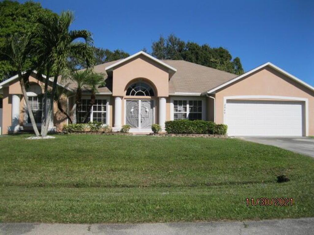 Photo of 2549 SE Tiger Avenue Ave, Port St Lucie, FL 34952 (MLS # R10763480)