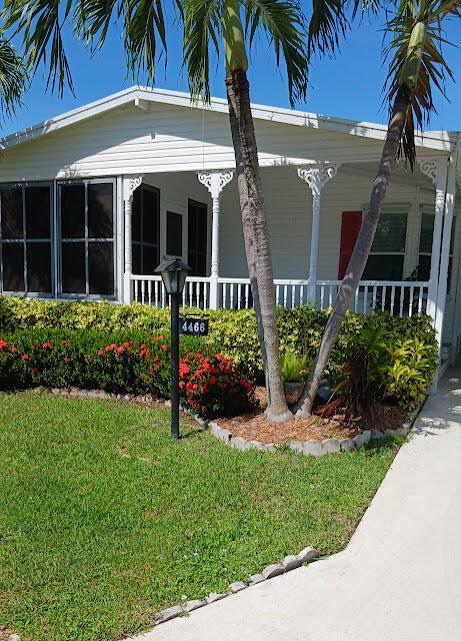 Coastal living (5 miles from the beach) in a lovely home that includes a golf cart...and bring your pet!!!!Turn-key home located in Pine Lake Gardens & Estates a 55+ community. Pull up to the large double wide driveway that wil fit two cars and a golf cart. A large utility room provides full size washer and dryer and lots of storage space. There are 2 bedrooms and 2 full bathrooms, with new laminate floors. The large master bedroom with fabulous walk-in closet includes upgraded shelving and built-ins. two clubhouses, each offering a pool, hot tub, as well as horseshoes, shuffle board, pickle ball, tennis court, and many other leisure activities. This home comes with a golf cart (2016 EZ Go with new batteries) This is a deal!!!