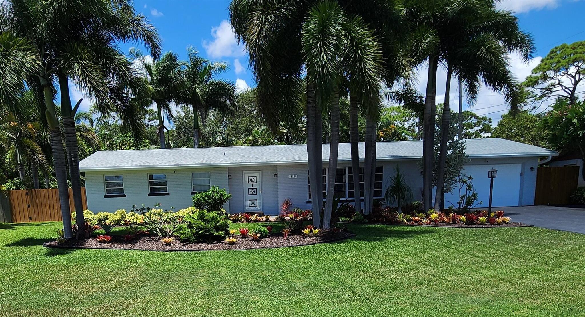 This beautifully maintained Ranch-style residence is freshly painted, move-in ready and waiting for you. Situated on a meticulously landscaped lot with a well sprinkler system. This home offers both charm and practicality.Enjoy a spacious, sparkling pool. Perfect for relaxing or entertaining along with a large screened lanai to soak up the Florida lifestyle all year round.The oversized two-car garage provides ample space, and the side gate offers approximately 30 feet of secure storage for your boat, RV, or commercial vehicle. Fully fenced in private backyard. Conveniently located just minutes from I-95, the Turnpike, Palm Beach International Airport, and only 10 minutes from vibrant Downtown WPB.Easy to show 7 days a week, furniture is negotiable, so move with ease!