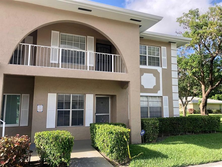 FIRST FLOOR - CORNER - PRIVATE - GARDEN VIEWS! Light and bright two bedroom, two bathroom, first floor condo with expansive garden views invites you to enjoy the beautiful Florida lifestyle!  A large master bedroom features a walk-in closet and abundant views of the peaceful garden facing east and north. Guest bedroom with pocket doors has an en-suite bathroom with a shower, also overlooking the quiet garden, facing east and south. The kitchen features white cabinets with brass door handles and updated faucet.
Tile is featured throughout the condo. Park your car right in front of the unit. Minutes to the entertainment, dining and beaches!