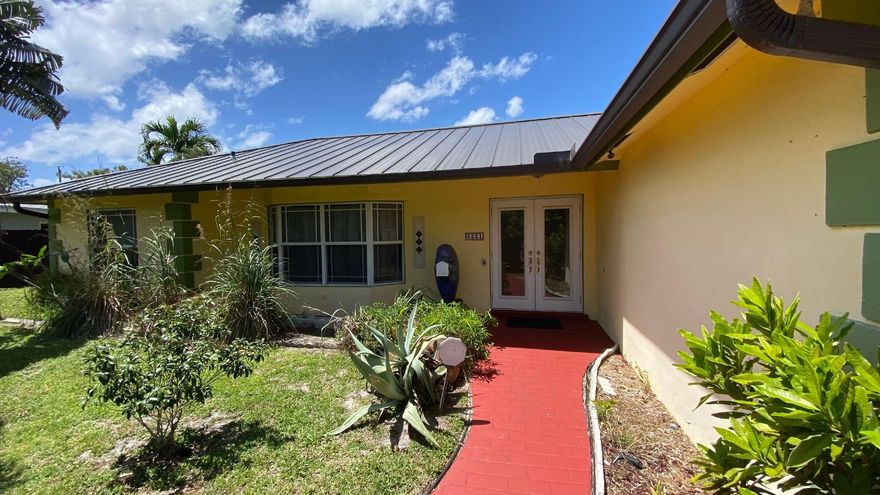 This home is located in the very popular eastside neighborhood of Knoll Ridge.  This 3/2 pool home with a family room and a two car garage features a three year new metal roof, a Generac generator, Impact windows (except sliders which have shutters), Impact Garage door, a Heated pool with a new pool pump, the  A/C and kitchen appliances are just 3 years old.   Plus all the underground plumbing has been replaced with PVC and the electric panel is updated.  No Homeowners Association.  Just one mile to the beach and close to all the best shopping & restaurants.  Just a few blocks to A rated Floranada Elementary school,  Pine Crest School & Westminster Academy.