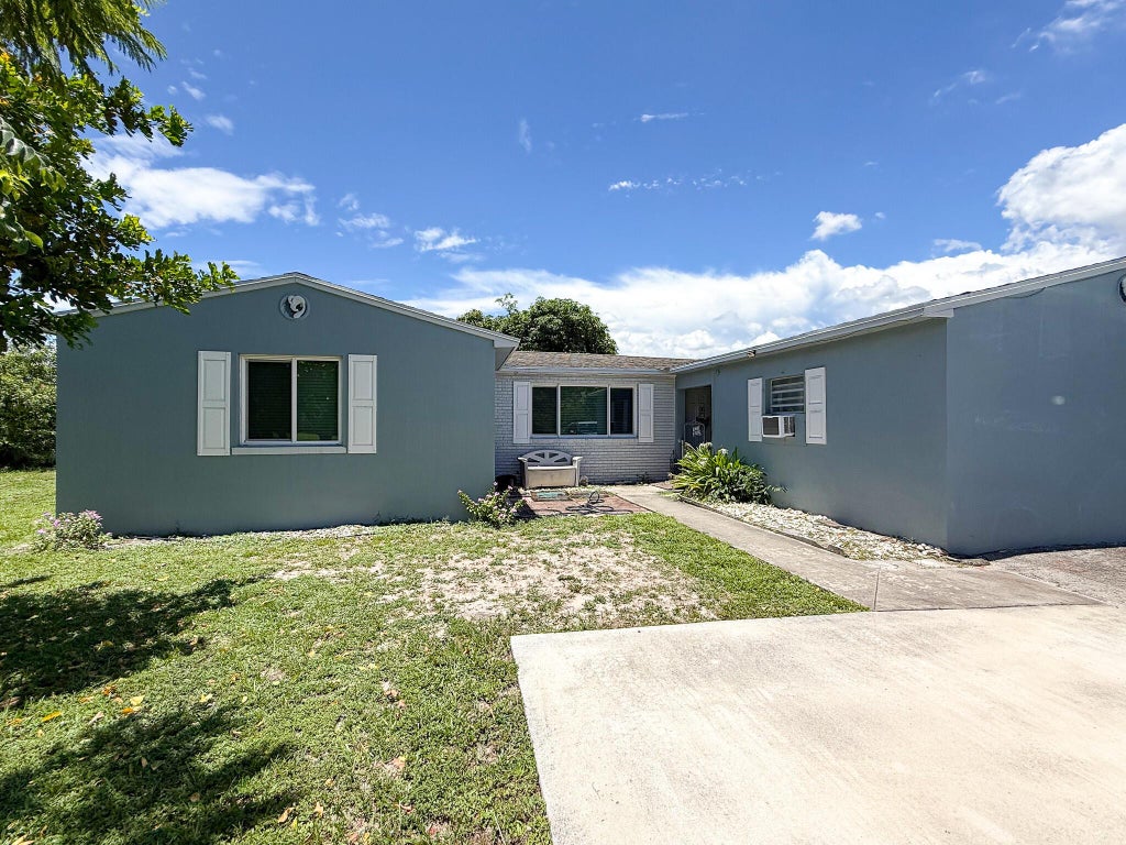 Photo of 1097 Palmetto Road, Haverhill, FL 33417 (MLS # R11110060)